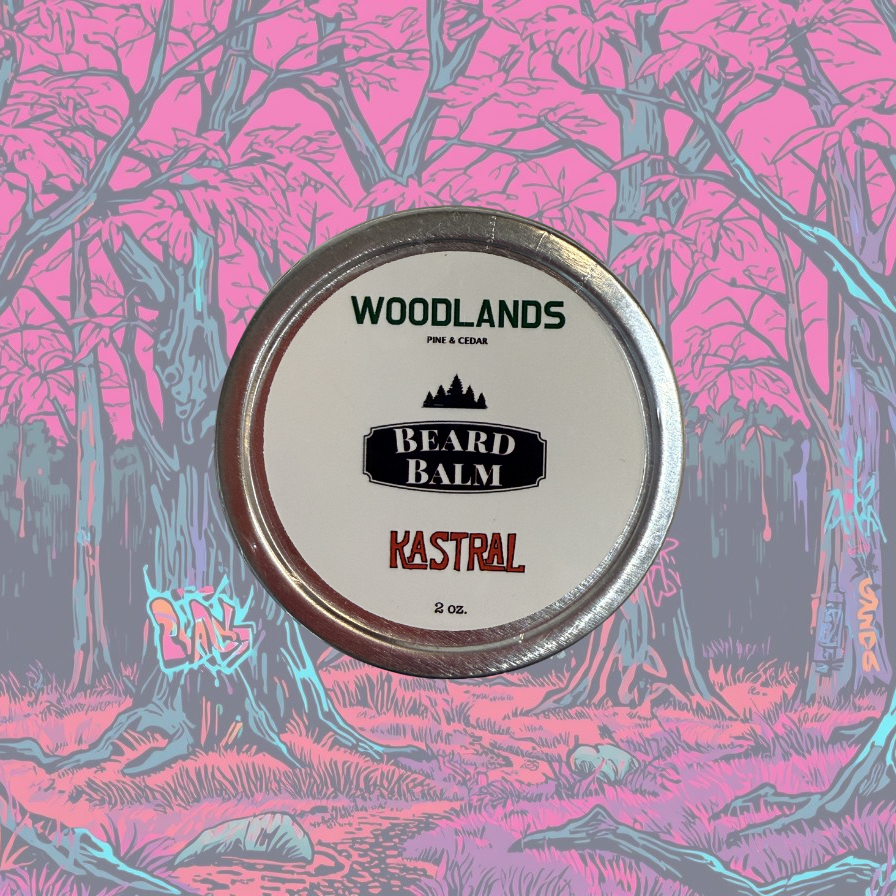 Beard balm container labeled 'Woodlands' with a stylized forest background.