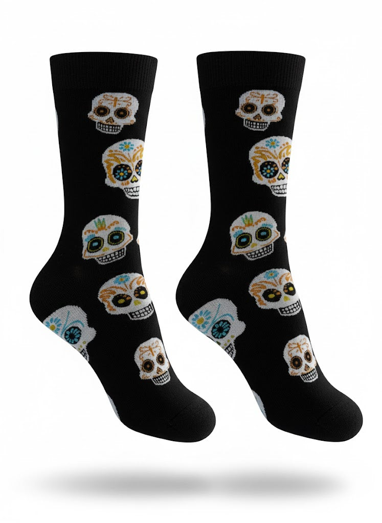 Black socks with colorful skull designs on a white background
